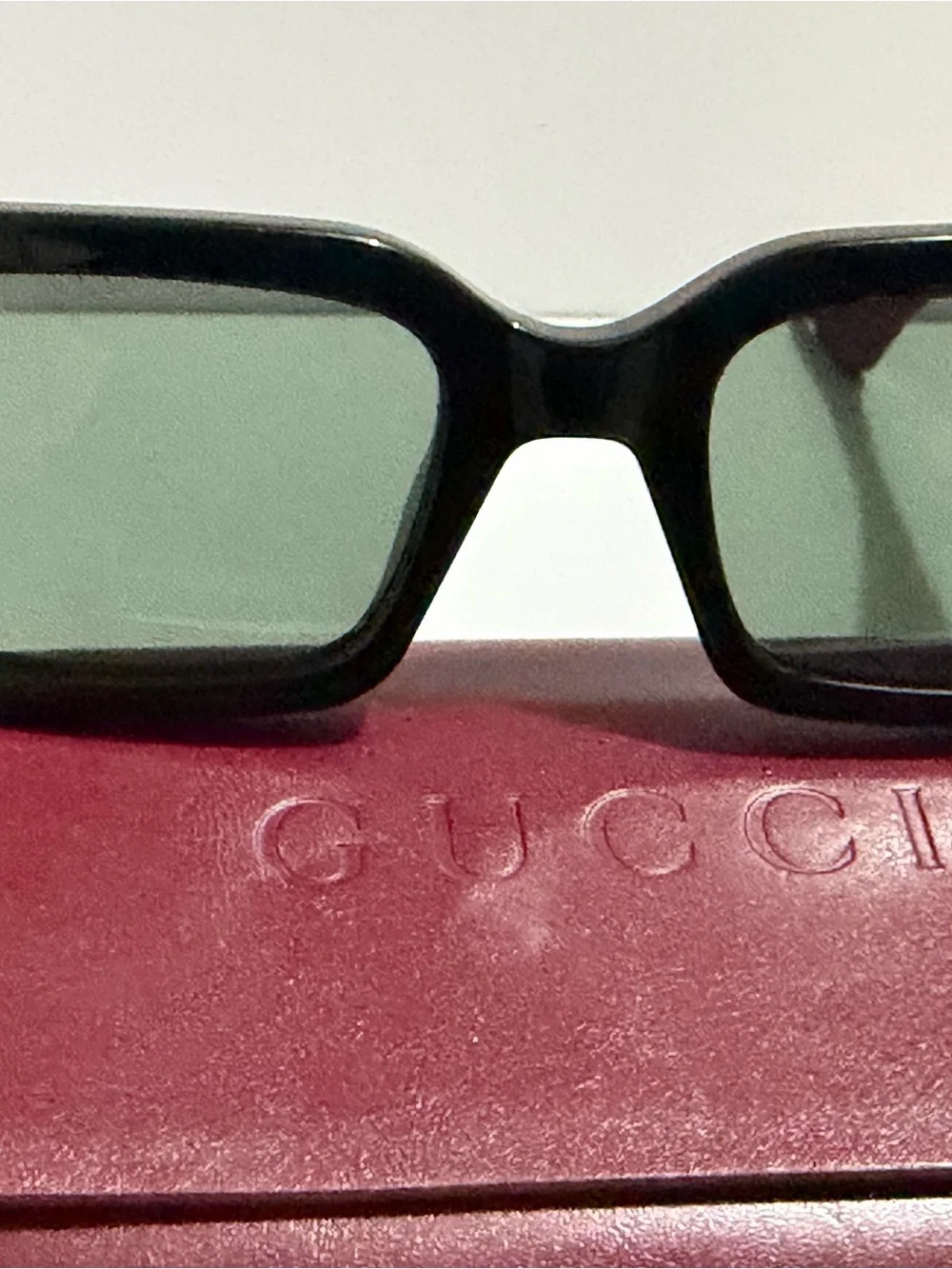 Gucci Black Frame Sunglasses with Red Temples and Gold Logo